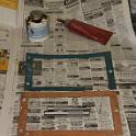 And here's the reason for the leak.  The top (blue) gasket is off the lathe, and is missing a chunk along the lower part of the box.  Some clown at Chicago College (hopefully not the instructor) had removed the box, damaged the gasket and put it back anyway.  In the bottom is a homemade one that I was originally going to use.  Up top on the left is a can of the gasket goop is usually use when replacing things on my motorcycles.  While retrieving that, I found a long forgotten tube of Locktite 515.  This is supposed to be able to make a gasket.  I decided to use this instead; we'll see.