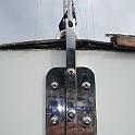 The plate is 304 stainless, 3/8' thick.  The center rod is 1" square stock.  The two are bolted AND welded together.  Inside the transom, a somewhat larger 3/8" plate is epoxied in place to act as a substantial backing plate.  The bolts are 3/8".  This fixture would probably be adequate for a 50 foot boat; should last forever on FIrst Edition.  Note the finger at the top.  I consider this a key design feature, as it removes the need for an additional toggle.  (Most of the boats I looked at just used a piece of 3/16" plate, bent to approximately the right angle.  To my eye, this puts enormous strain on the fitting, in exactly the same plane as the "worrying" forces causes by mast movement.